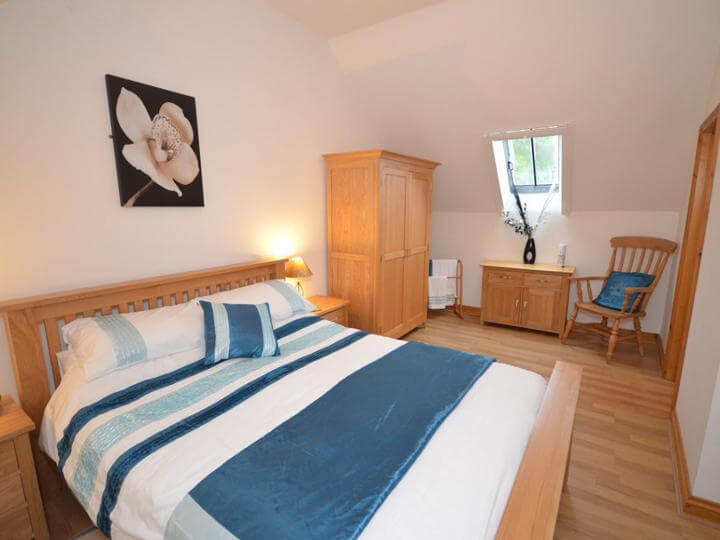 Views towards the cottage with enclosed patio area.