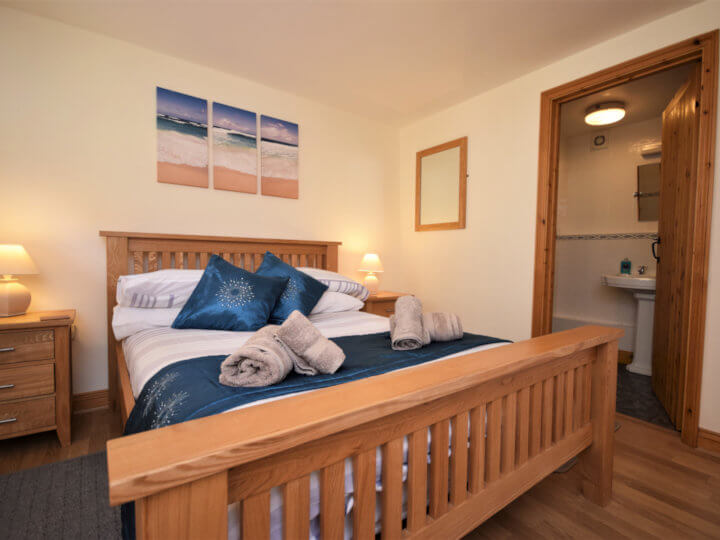 Views towards the cottage with enclosed patio area.