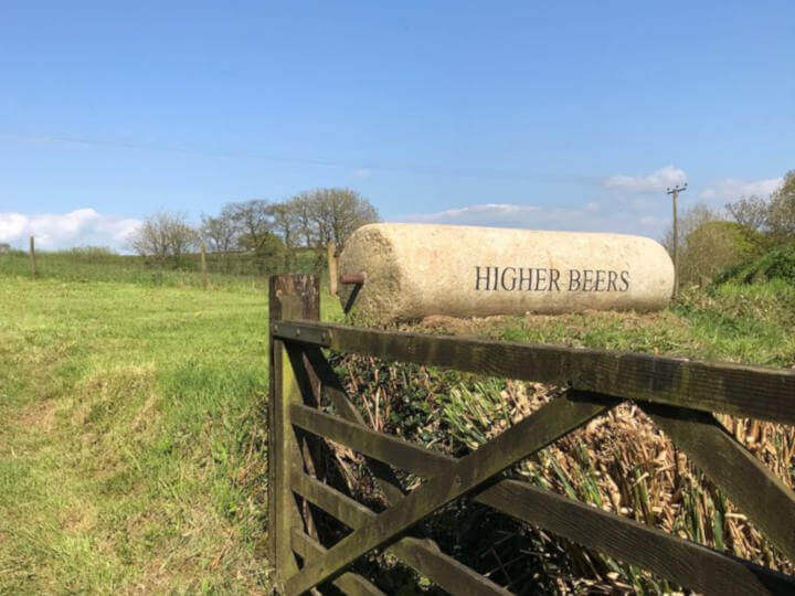 Views towards the cottage with enclosed patio area.