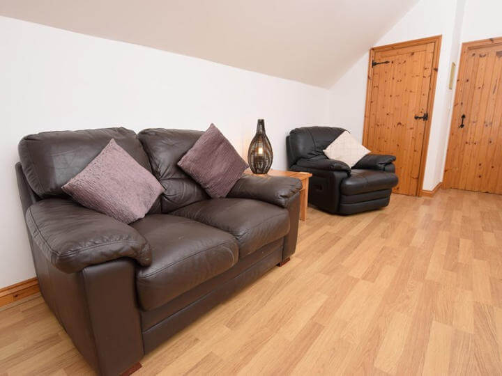 Views towards the cottage with enclosed patio area.