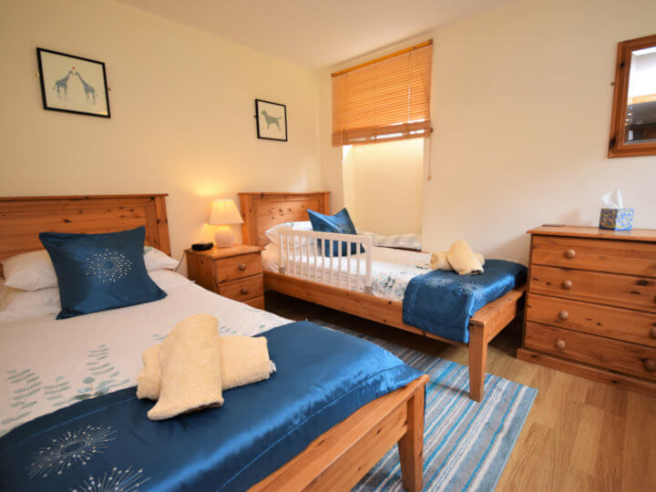 Views towards the cottage with enclosed patio area.